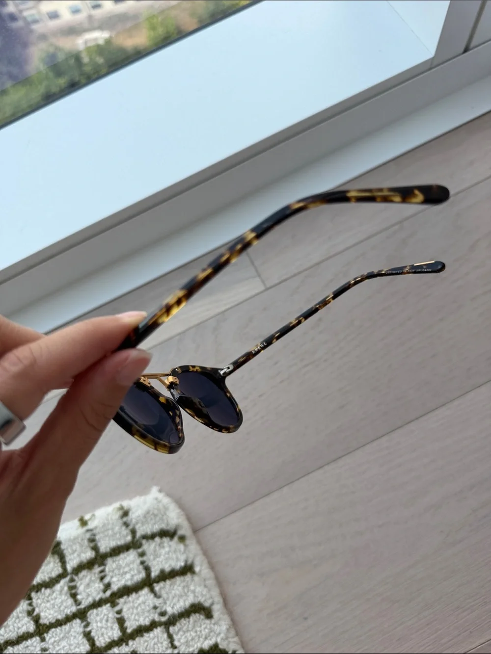 KREWE Tortoiseshell Round Sunglasses with Gold Bridge and Dark Lenses